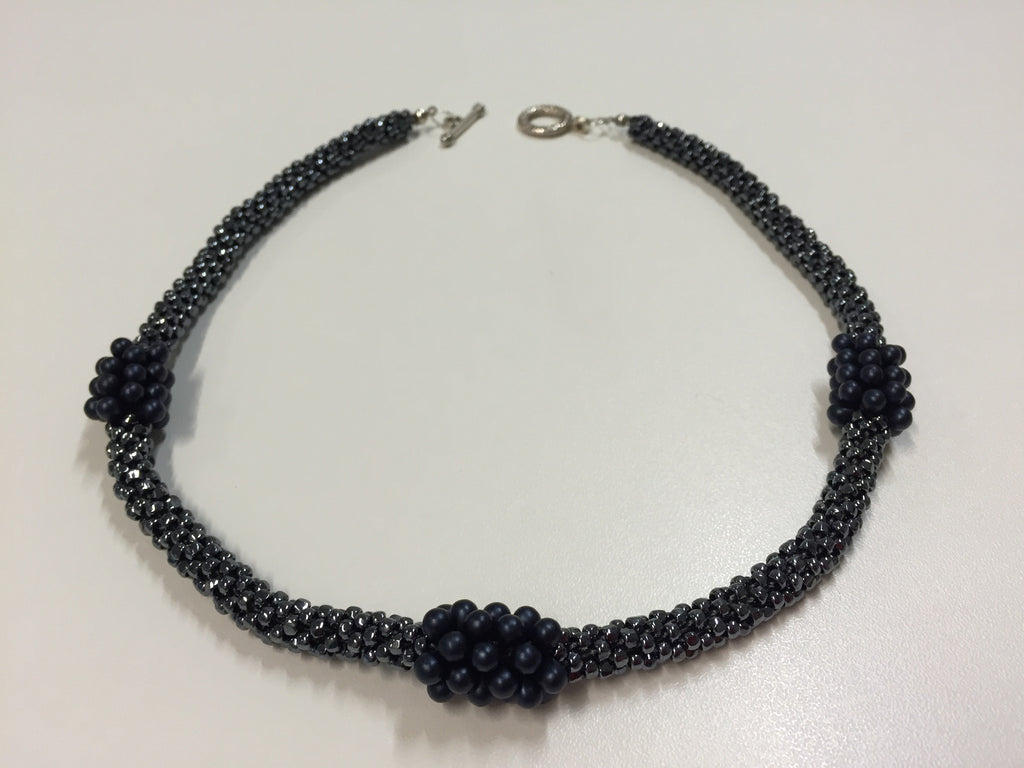 Shining twilight necklace boasting deep blue embellishments, with silver fastening