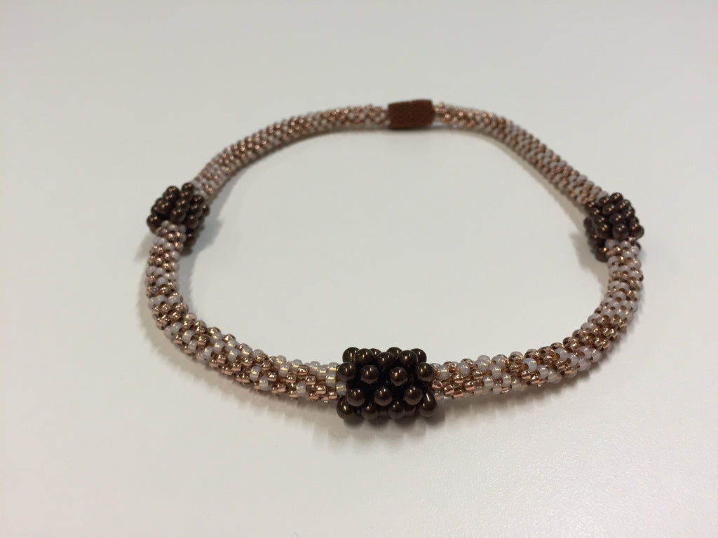 Beautiful hand-crafted copper-gold necklace with dark chocolate embellishments