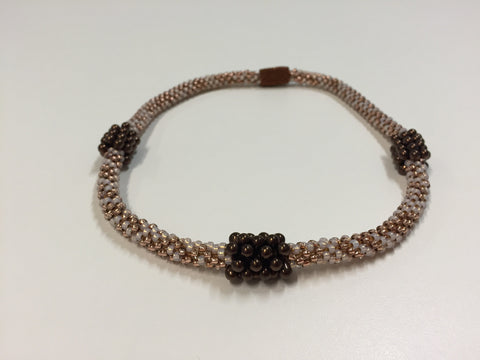 Beautiful hand-crafted copper-gold necklace with dark chocolate embellishments